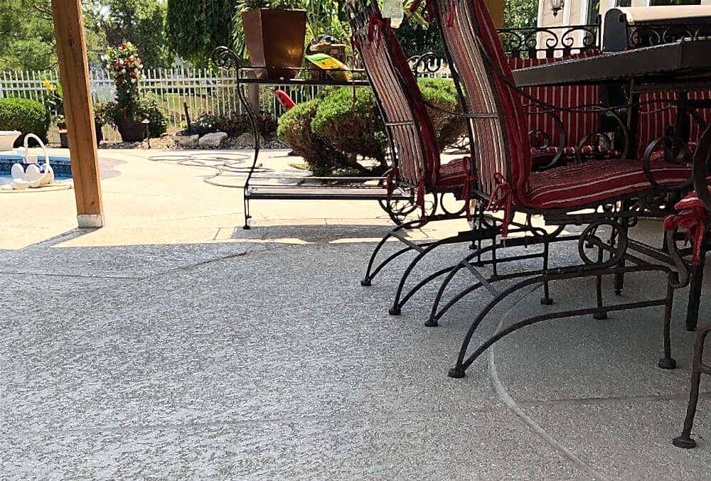 Spray knockdown texture patio with chairs and table