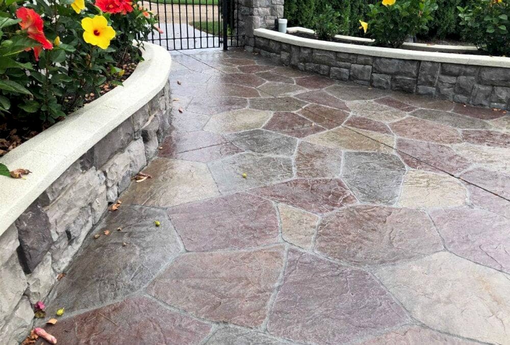 Multi-colored stained and stamped concrete driveway